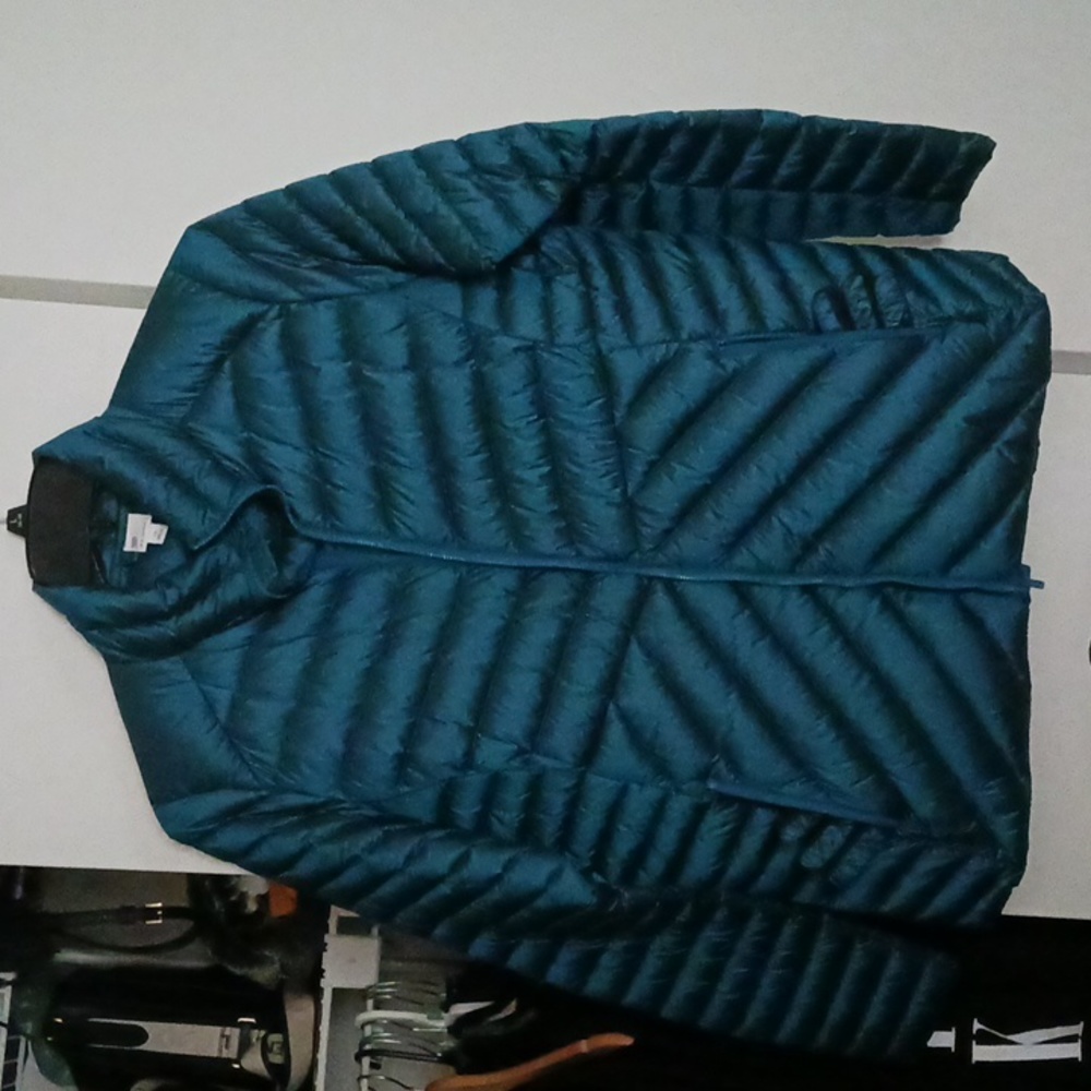 XL teal slightly puffer jacket with stand-up collar and zipper closure.